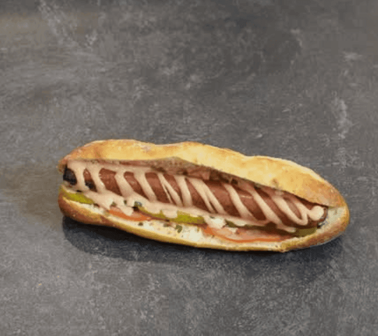 Griddled all-beef hot dog topped with toum garlic sauce, grilled onions, and pickled turnips, Patar Shawarma Glendale